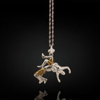 925 sterling silver wrestler pendant with partial gold plating – handcrafted in the EU, perfect for birthdays, graduation, or holiday gifting.

This striking pendant blends solid 925 silver with subtle gold detailing, creating a refined contrast that mirrors both discipline and intensity. Featuring a freestyle wrestler captured mid-suplex, it’s a bold tribute to technique, focus, and timeless strength.

Ideal for men who value precision, energy, and classic athletic craftsmanship.