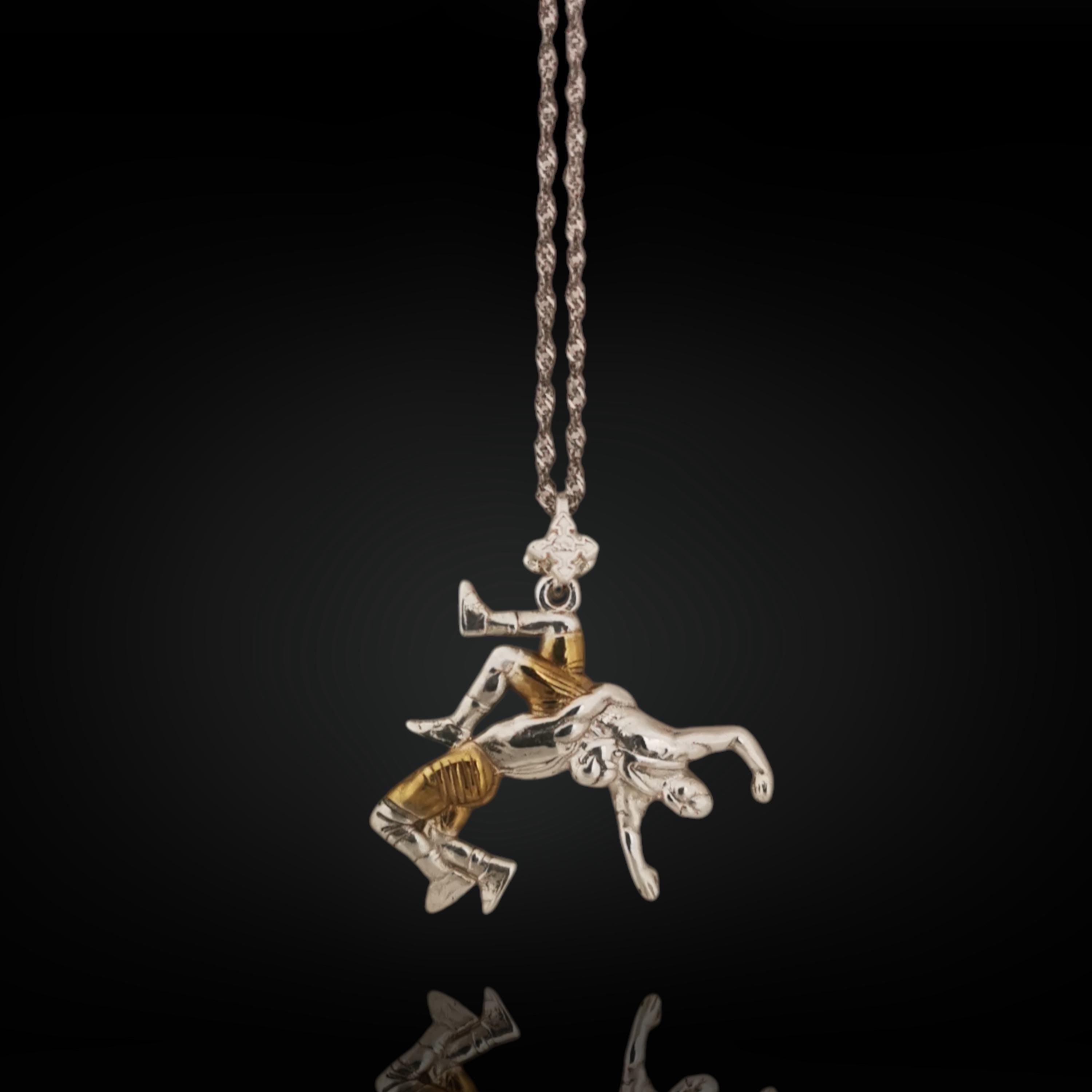 925 sterling silver wrestler pendant with partial gold plating – handcrafted in the EU, perfect for birthdays, graduation, or holiday gifting.

This striking pendant blends solid 925 silver with subtle gold detailing, creating a refined contrast that mirrors both discipline and intensity. Featuring a freestyle wrestler captured mid-suplex, it’s a bold tribute to technique, focus, and timeless strength.

Ideal for men who value precision, energy, and classic athletic craftsmanship.