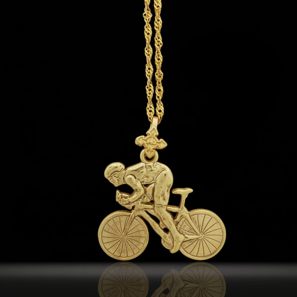 Gold-plated cycling necklace handcrafted from solid 925 sterling silver — a bold, luxurious piece made for men who live to ride. Finished with radiant gold plating, this pendant celebrates strength, endurance, and personal achievement.

Featuring a dynamic cyclist in motion, this pendant captures the spirit of speed and precision — ideal for road bikers, spinning athletes, or anyone inspired by physical challenge and discipline.