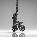 Black oxidized cyclist pendant handcrafted from solid 925 sterling silver — a rugged and masculine design for men who live with purpose, strength, and motion.

Featuring a confident rider standing beside his bike, arms crossed in pride, this piece embodies discipline, endurance, and an unshakable mindset. The matte oxidized black finish adds edge and intensity, making it a striking accessory for urban cyclists, fitness lovers, and bold personalities.