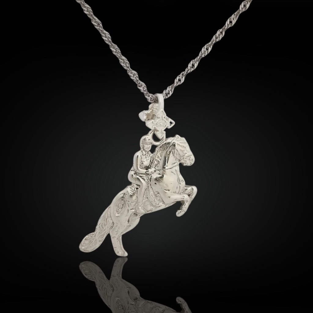 Solid 925 sterling silver equestrian pendant – handcrafted in the EU, perfect for birthdays, graduations, or meaningful milestones in the riding arena.

This elegant pendant captures the harmony, power, and grace of a horse and rider in classical motion. Inspired by the noble traditions of dressage and haute école, it reflects discipline, passion, and timeless equestrian beauty.
