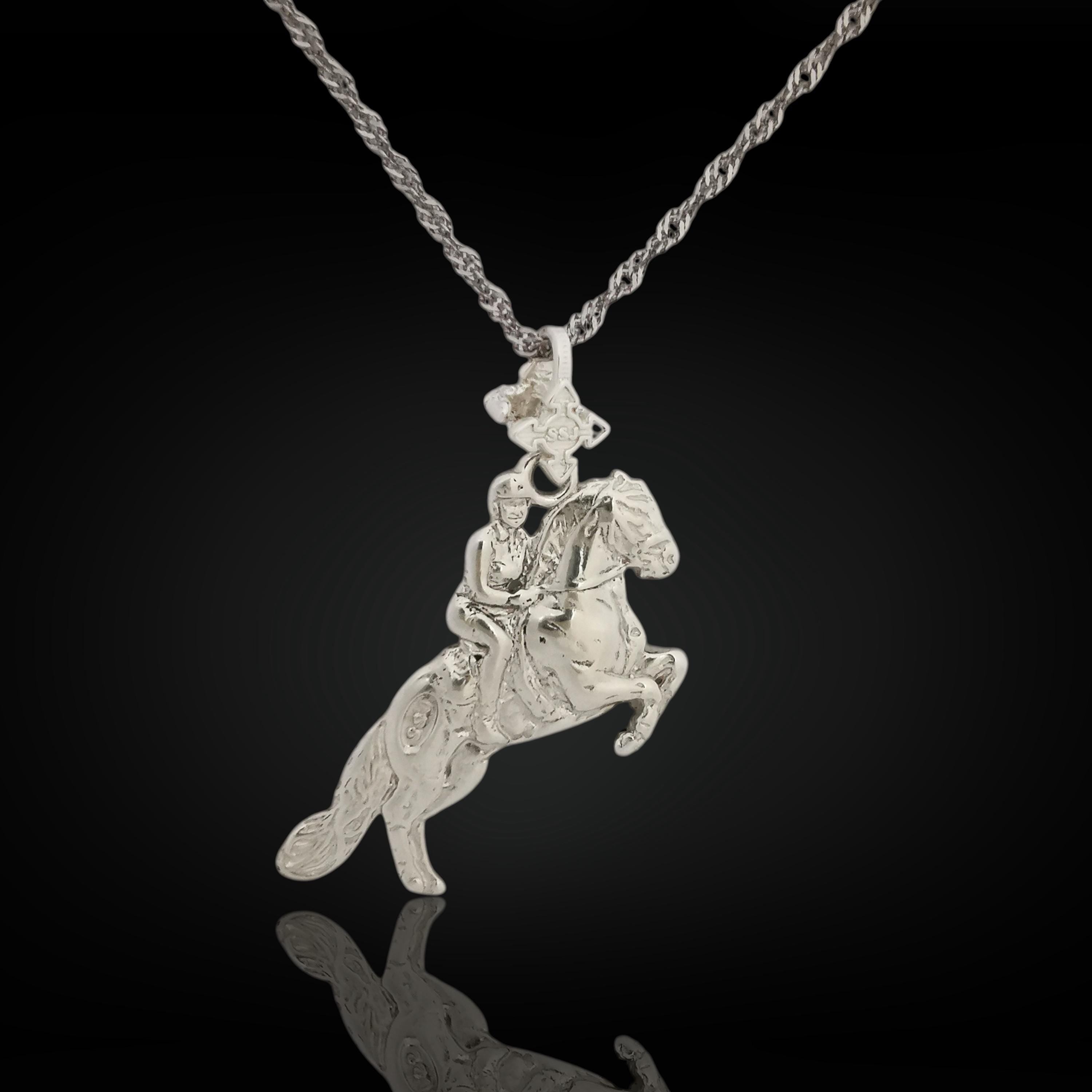 Solid 925 sterling silver equestrian pendant – handcrafted in the EU, perfect for birthdays, graduations, or meaningful milestones in the riding arena.

This elegant pendant captures the harmony, power, and grace of a horse and rider in classical motion. Inspired by the noble traditions of dressage and haute école, it reflects discipline, passion, and timeless equestrian beauty.
