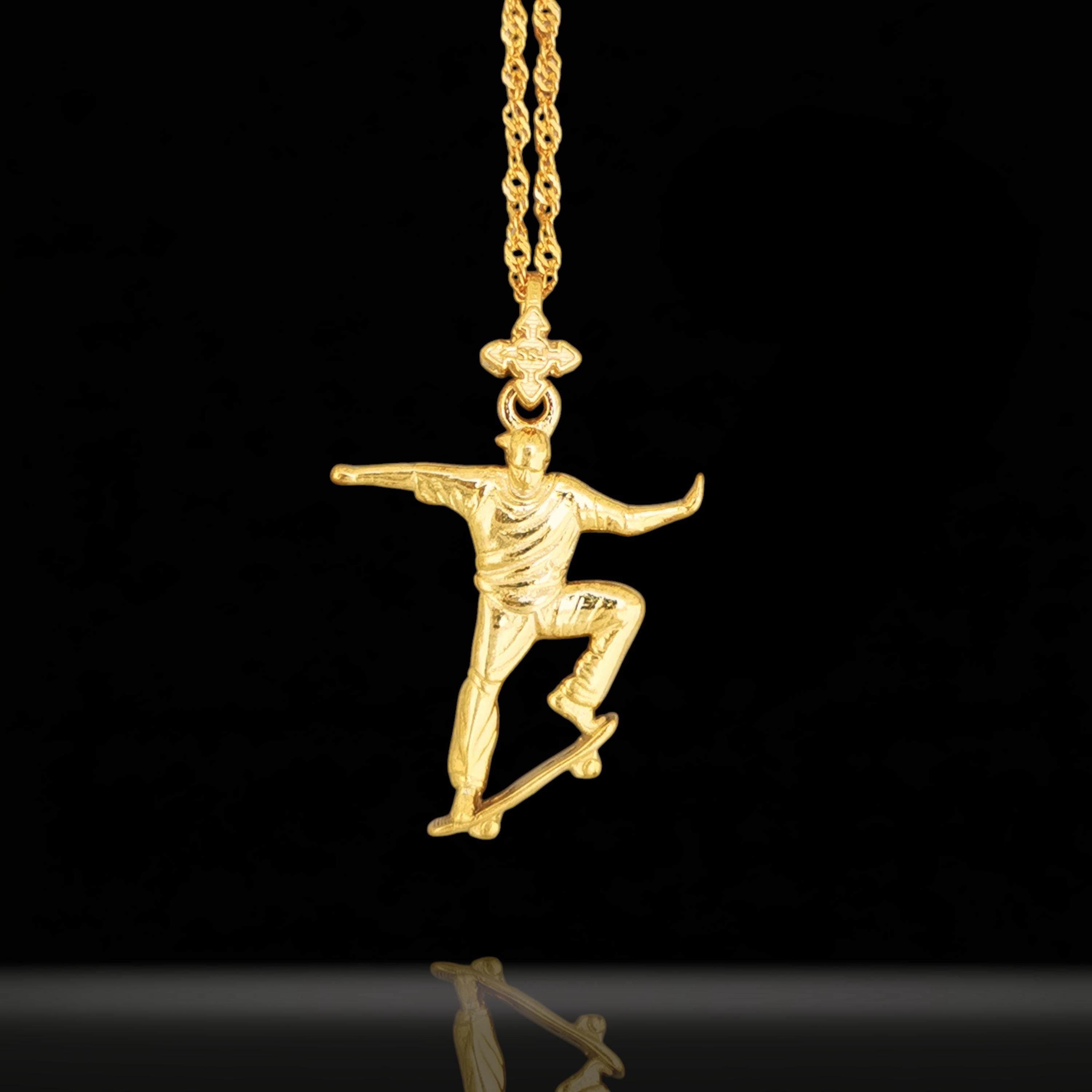 Gold skateboard necklace made from solid 925 sterling silver with polished gold plating – a bold streetwear pendant for skaters, athletes, and urban style lovers. This handcrafted piece captures the fearless spirit of freestyle culture with motion, attitude, and shine.

Featuring a skateboarder mid-trick, this pendant speaks to those who push limits, embrace movement, and lead with confidence. A powerful accessory for anyone who rides hard and lives bold.