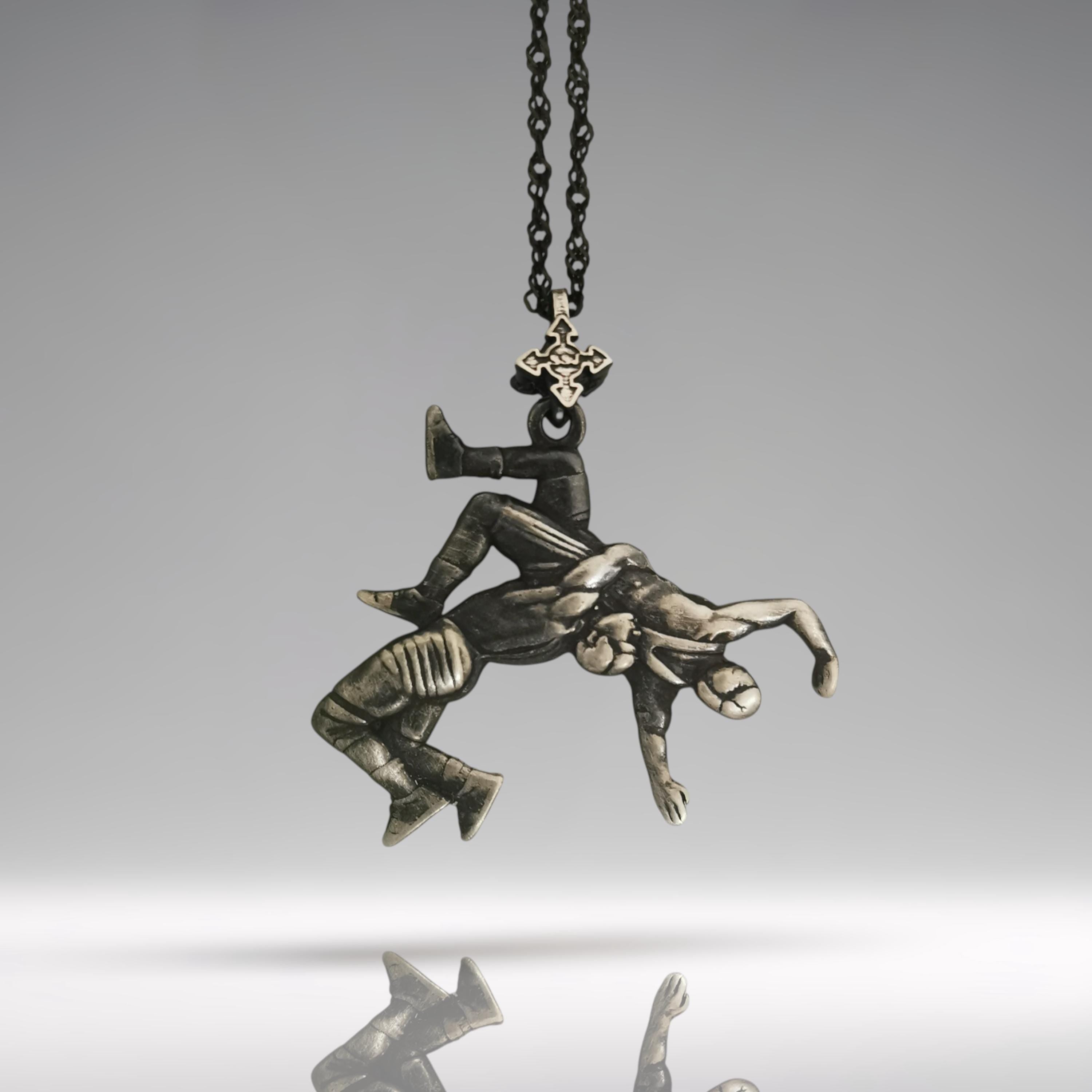 Vintage-Style 925 Sterling Silver Wrestling Pendant for Men – Handmade in the EU, perfect gift for athletes, coaches, or Father’s Day.

Crafted with an antique patina, this rugged pendant captures the intensity of Greco-Roman wrestling, frozen mid-suplex — a powerful symbol of strength, control, and discipline. A timeless piece for those who respect the legacy of combat sports and Olympic tradition.