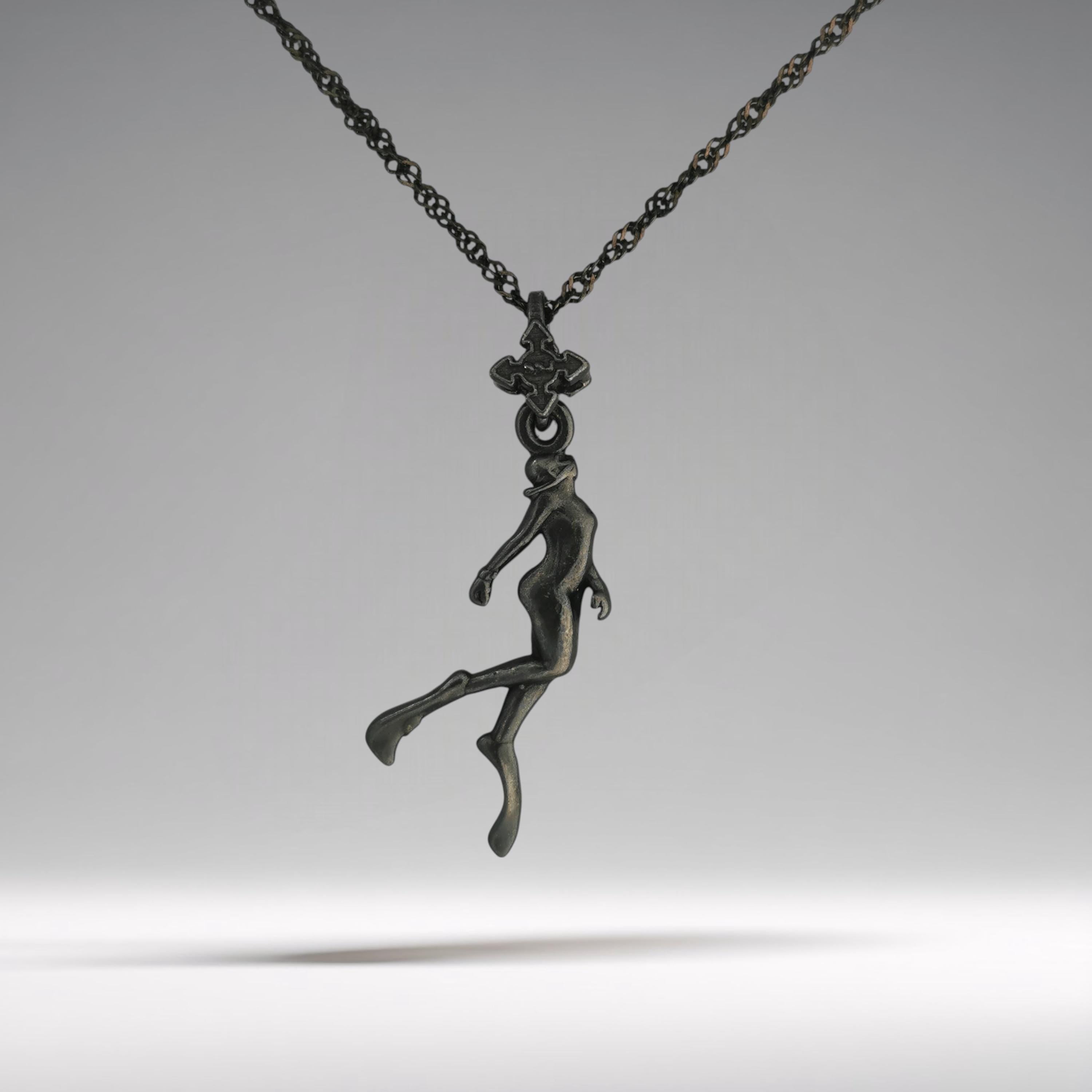 Black oxidized diving necklace for women — a graceful 925 silver pendant honoring the freedom, motion, and beauty of the underwater world.

This sculpted figure of a female diver flows effortlessly, as if suspended in deep silence. Finished in matte oxidized black, it highlights every curve with striking depth and contrast. A poetic piece that symbolizes strength, serenity, and a fearless love of the sea.