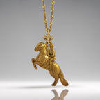 Gold-plated 925 sterling silver equestrian pendant – handcrafted in the EU, perfect for birthdays, holidays, or meaningful gifts.

Featuring a rearing horse and rider in classical pose, this pendant blends timeless symbolism with refined gold finish. Inspired by dressage and haute école, it honors strength, focus, and elegance in motion.

A meaningful piece for anyone who loves horses and the beauty of equestrian tradition.