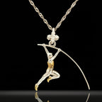 Two-tone pole vault necklace for men — a bold and symbolic pendant honoring strength, elevation, and the relentless pursuit of personal bests.

Handcrafted from solid 925 sterling silver and enhanced with partial gold plating, this dynamic figure captures the explosive motion of a vaulter mid-flight. Designed for athletes who rise above limits and those who live with discipline, energy, and focus.