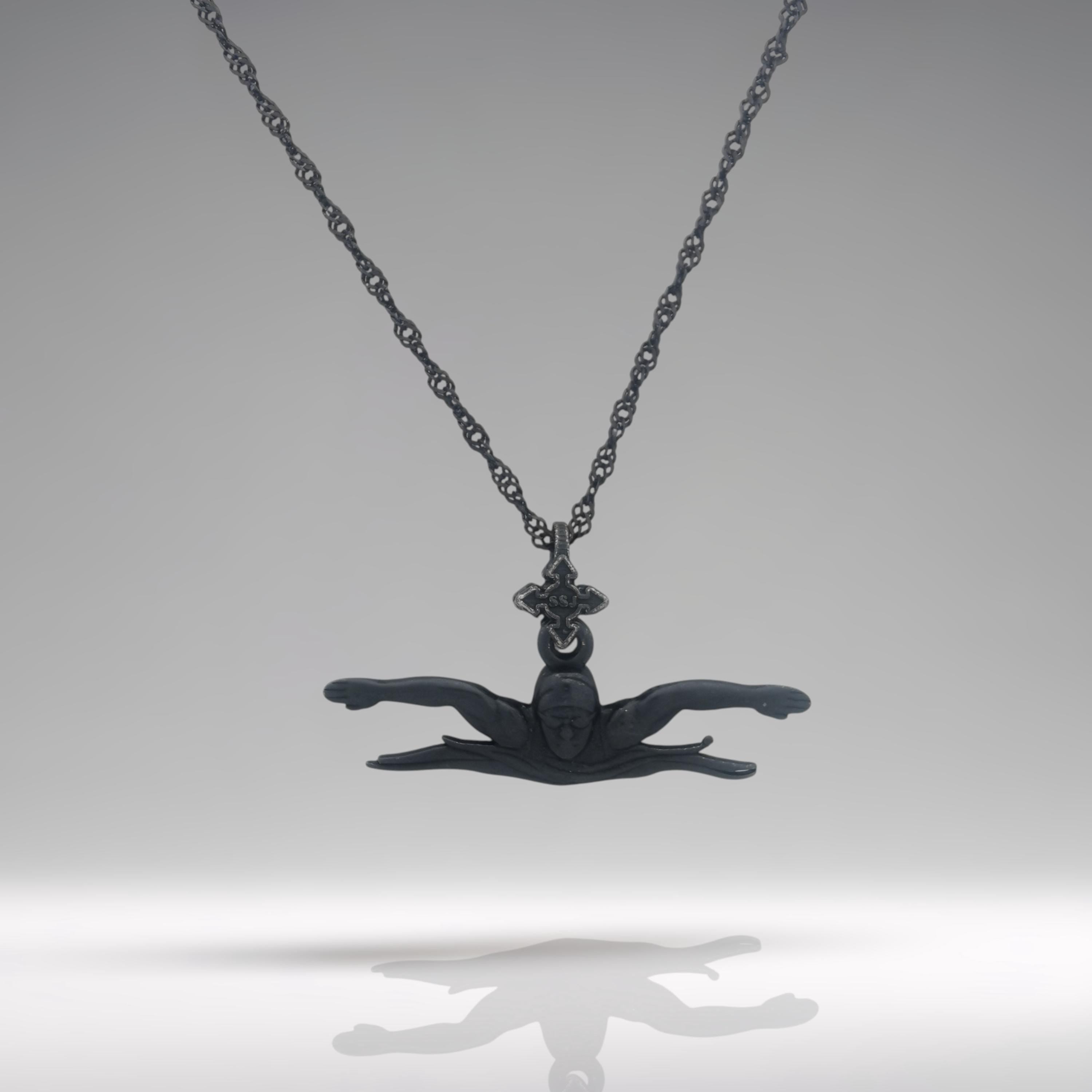 Oxidized black butterfly swimming necklace handcrafted from solid 925 sterling silver — a bold and powerful pendant for men and teen boys who thrive in water.

This dynamic design captures the essence of the butterfly stroke: strong, focused, and fluid. With a rugged matte black finish, the pendant embodies endurance and determination — perfect for swimmers who lead with strength and confidence. A striking gift for milestones, sports events, or personal victories.