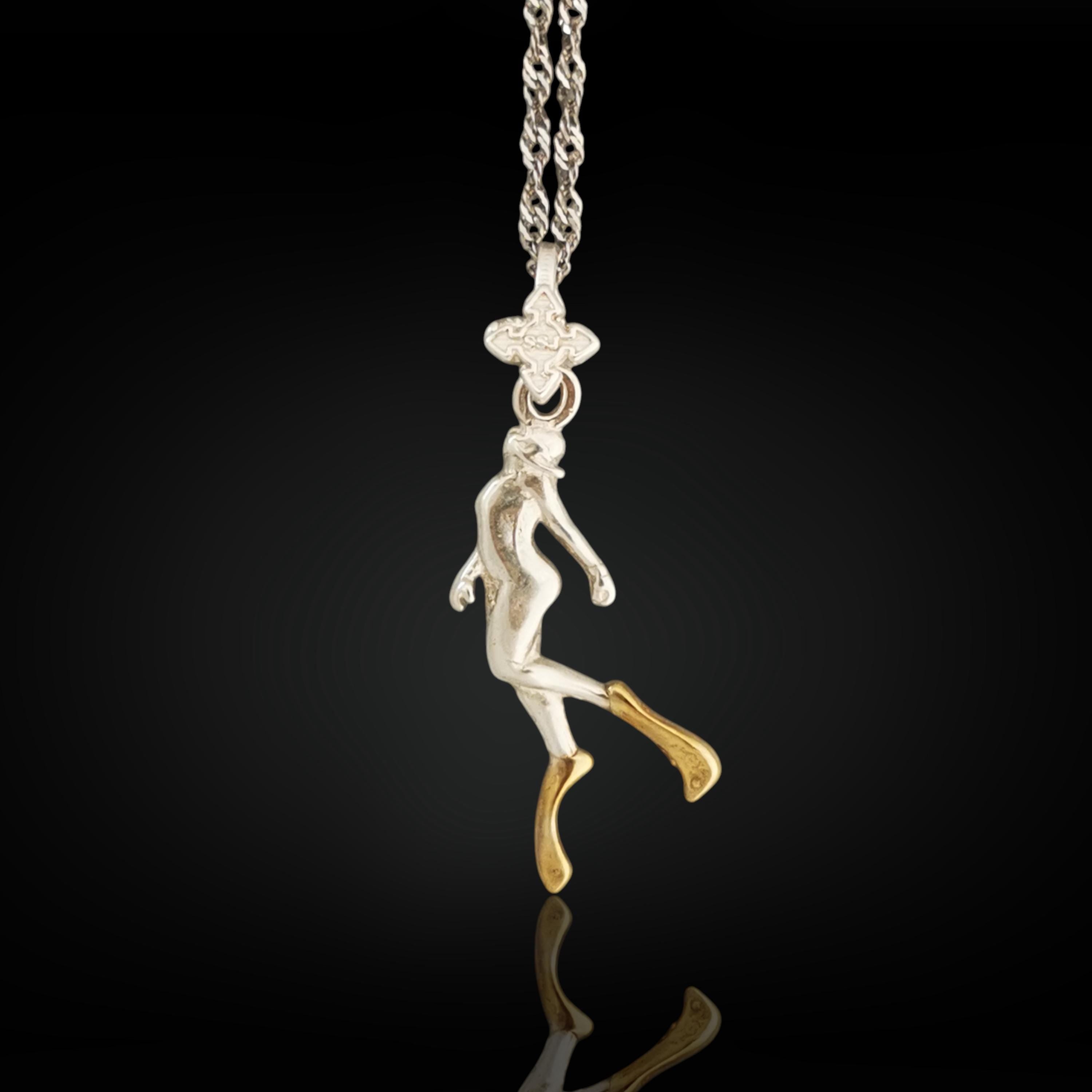 Two-tone diving necklace for women — a symbolic pendant blending silver and gold to honor elegance, strength, and love for the ocean.

This graceful diver design is sculpted in solid 925 sterling silver and accented with radiant partial gold plating. The flowing motion of the figure evokes serenity, movement, and depth — a meaningful piece for those who feel at home in the water.