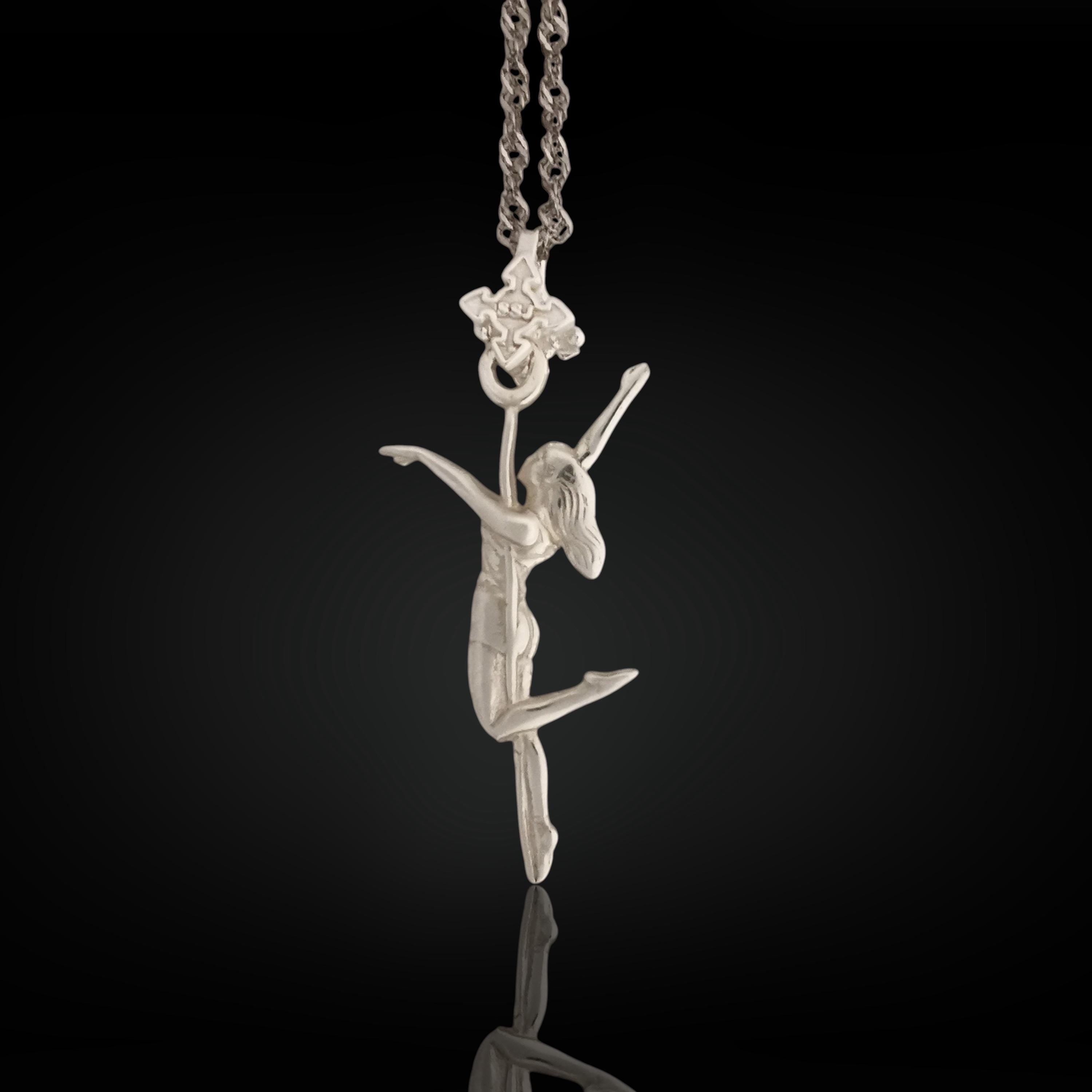 Pole dance pendant for women handcrafted in solid 925 sterling silver – a sleek design featuring a dancer wrapped around a vertical pole.

Clean silver tones and smooth lines highlight confidence, movement, and personal expression. A meaningful piece for women who celebrate strength and grace through motion.