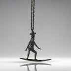 Black oxidized surf necklace handcrafted in solid 925 sterling silver — a sleek and soulful pendant celebrating the thrill of wave riding and the freedom of the open sea.

This expressive design captures a poised female surfer mid-ride, her body aligned with the board in perfect harmony. The dark matte finish adds mystery and edge, turning the piece into a powerful symbol of flow, balance, and untamed spirit. A tribute to women who live for the ocean breeze and move with fearless grace.