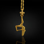 Gold-plated pole dance pendant crafted from solid 925 sterling silver — a radiant and daring symbol of feminine power, movement, and elegance.

The pendant features a dancer in a captivating upside-down pose, full of grace and expression. The luxurious gold finish enhances every curve and detail, turning this piece into a celebration of sensuality, freedom, and self-confidence. Whether for a performer or admirer of pole artistry, this necklace is a golden tribute to beauty in motion.