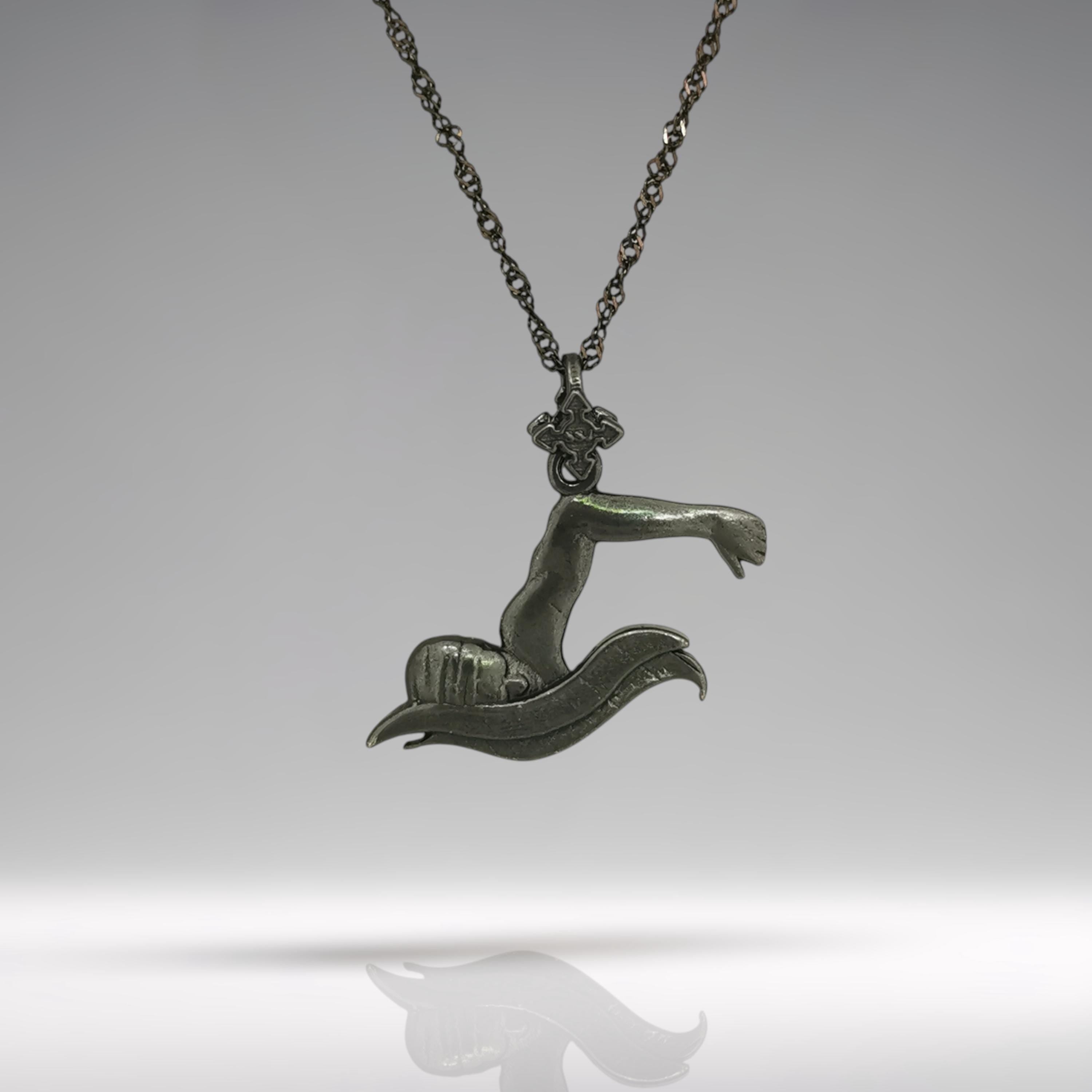 Oxidized black breaststroke necklace crafted from solid 925 sterling silver — a rugged and masculine pendant designed for male swimmers, teen athletes, and boys who train with intensity.

The sculpted design captures a swimmer mid-stroke in the breaststroke technique — focused, powerful, and cutting through water. The matte black finish adds edge and confidence, making it the perfect piece for those who thrive in the pool and compete with purpose.