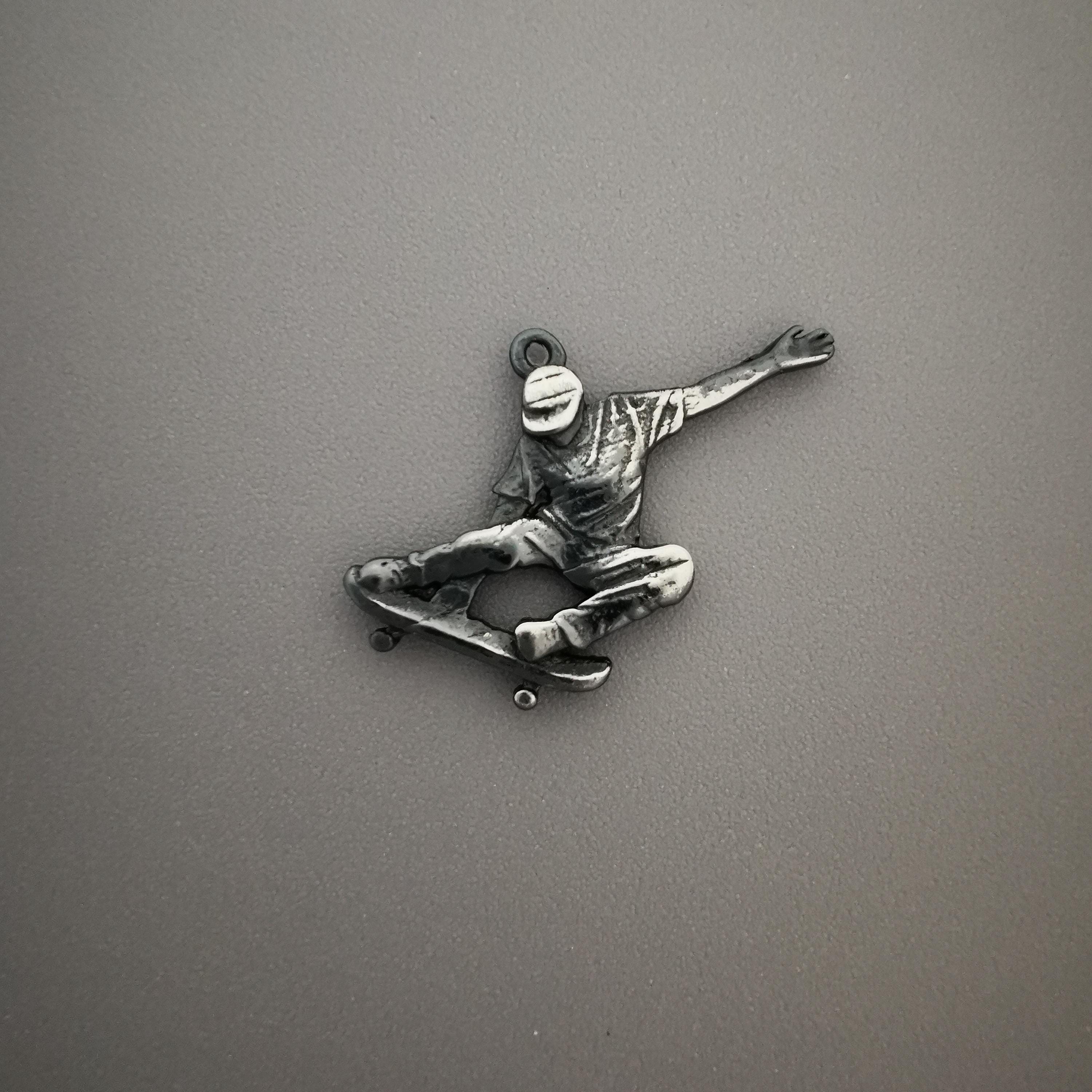 Vintage style skateboard necklace for men and teen boys handcrafted from 925 sterling silver with an antiqued finish – a rugged pendant designed for skaters, freestyle riders, and fans of classic streetwear culture. The aged surface and bold form capture the essence of movement, grit, and individuality.

This timeless piece channels street energy with a raw, expressive vibe. Built to stand out, it’s perfect for those who ride with attitude, live with confidence, and never stop pushing forward.