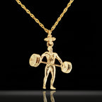 Gold-plated weightlifting necklace in 925 sterling silver – bold gym pendant made for strong-willed men who lift with passion. Designed for bodybuilders, coaches, and disciplined athletes, this piece combines elegance with raw power.

The handcrafted figure shows a male lifter mid-movement with a detailed barbell – a tribute to strength, endurance, and fitness goals. The rich gold-plated finish adds a modern yet classic edge, perfect for gifting or daily wear.