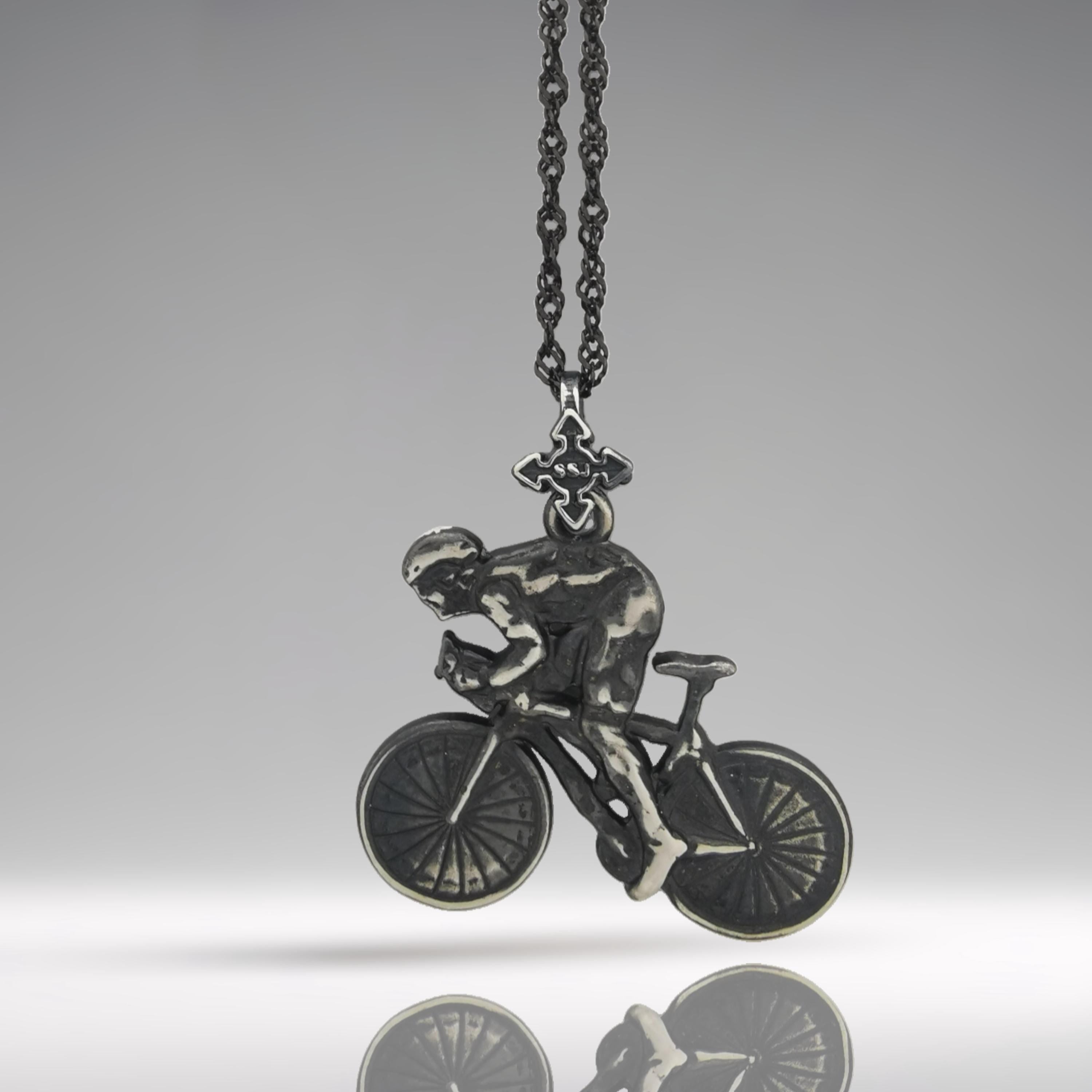 Vintage-style cycling pendant handcrafted from solid 925 sterling silver — a rugged and characterful accessory for men passionate about the ride. With its patinated finish and detailed design, it captures the essence of endurance, motion, and timeless strength.

This necklace features a cyclist in action, full of dynamic posture and grit — a wearable symbol of perseverance and power. A great piece for daily motivation or meaningful milestones.