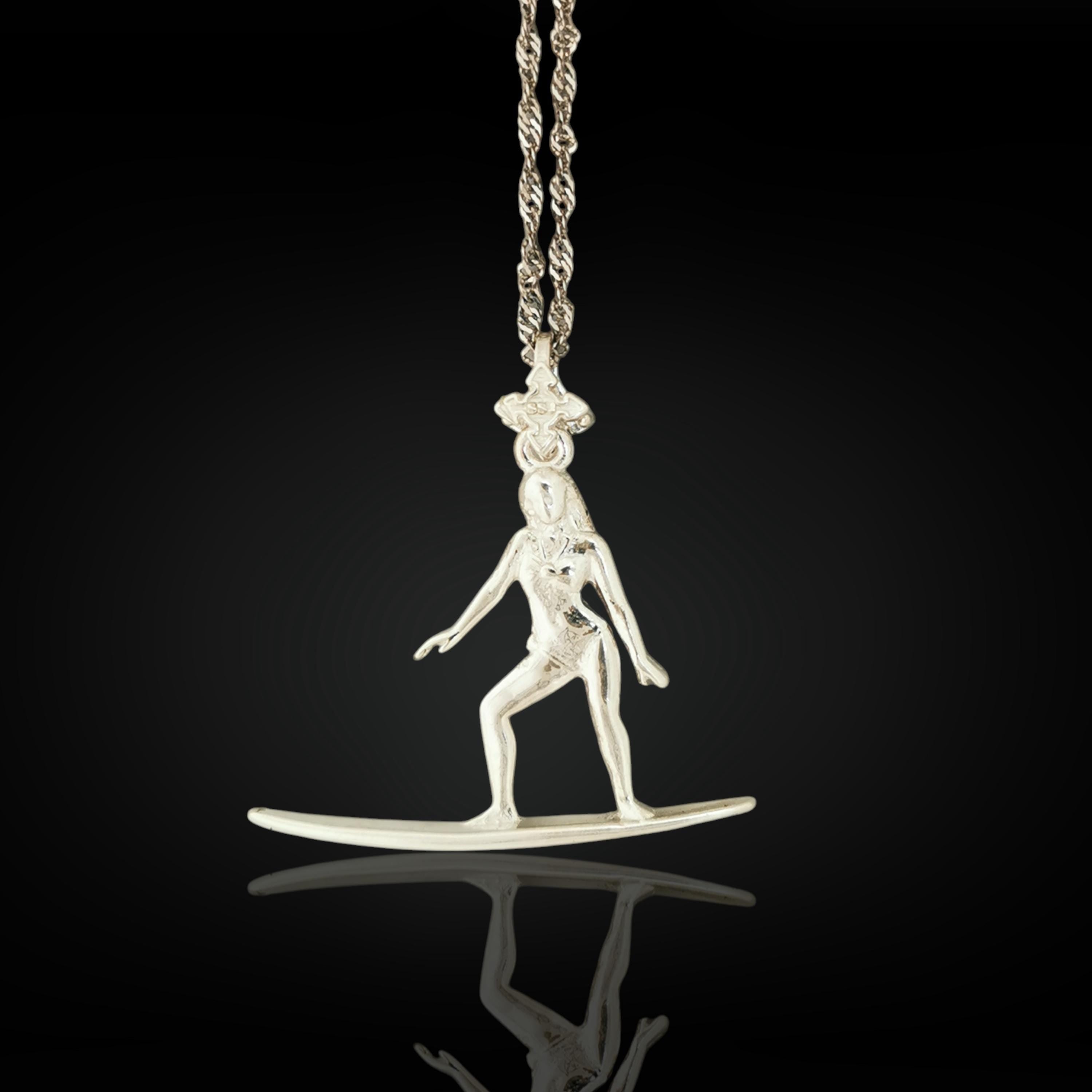 Classic silver surf girl necklace handcrafted from solid 925 sterling silver — a sleek and expressive pendant capturing the spirit of the sea, feminine grace, and love for the waves.

The design features a poised female surfer riding her board with confidence and balance. The clean silver finish highlights the movement and freedom of coastal life — perfect for women who carry the beach in their soul. Timeless, meaningful, and full of summer energy.
