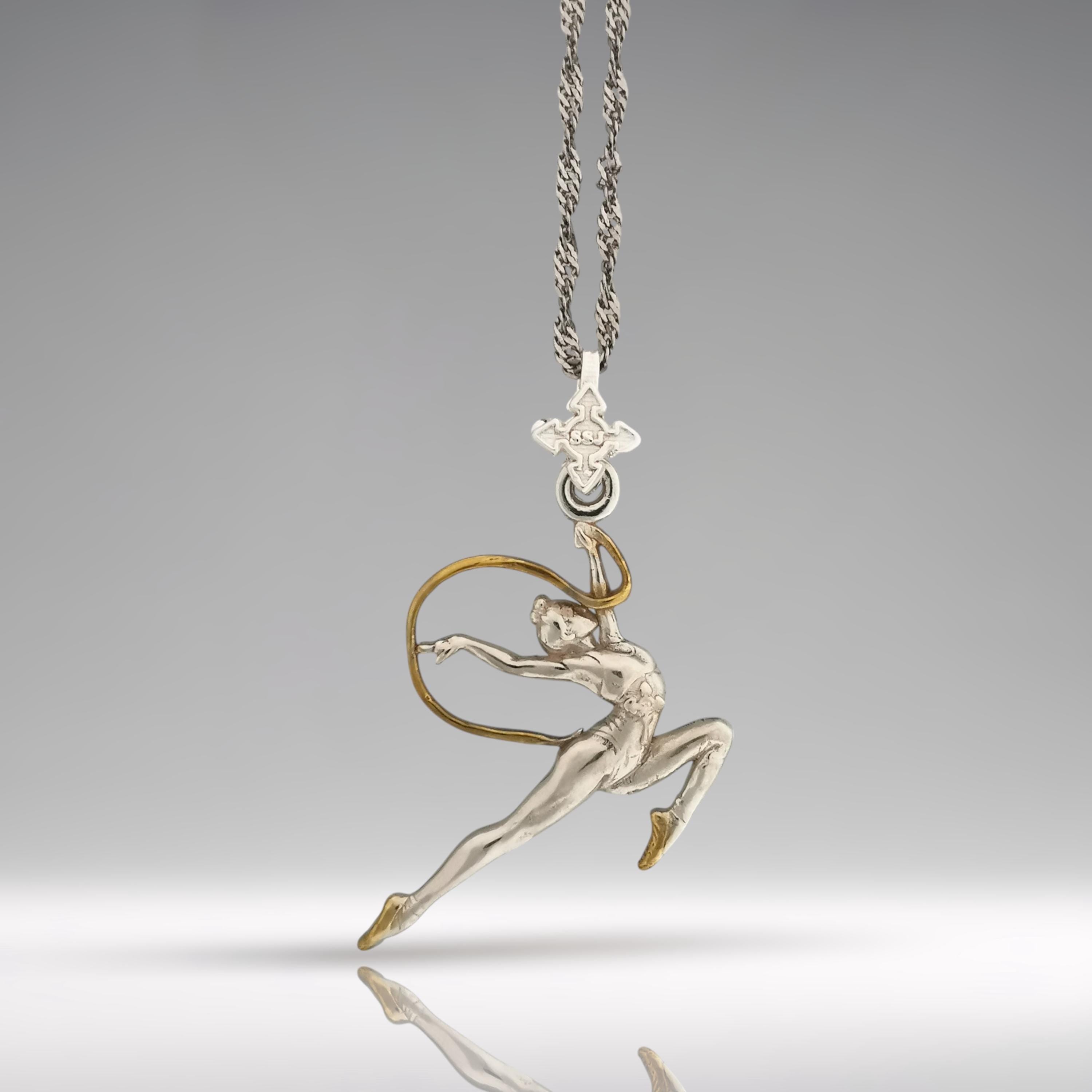 Rhythmic gymnastics pendant in 925 silver with partial gold plating – premium handcrafted jewelry for girls who move with elegance, confidence, and artistry.

🎁 Perfect gift for:
• Rhythmic gymnasts, fans, coaches
• Girls, teen athletes, dancers
• Sport achievements, motivation, birthdays