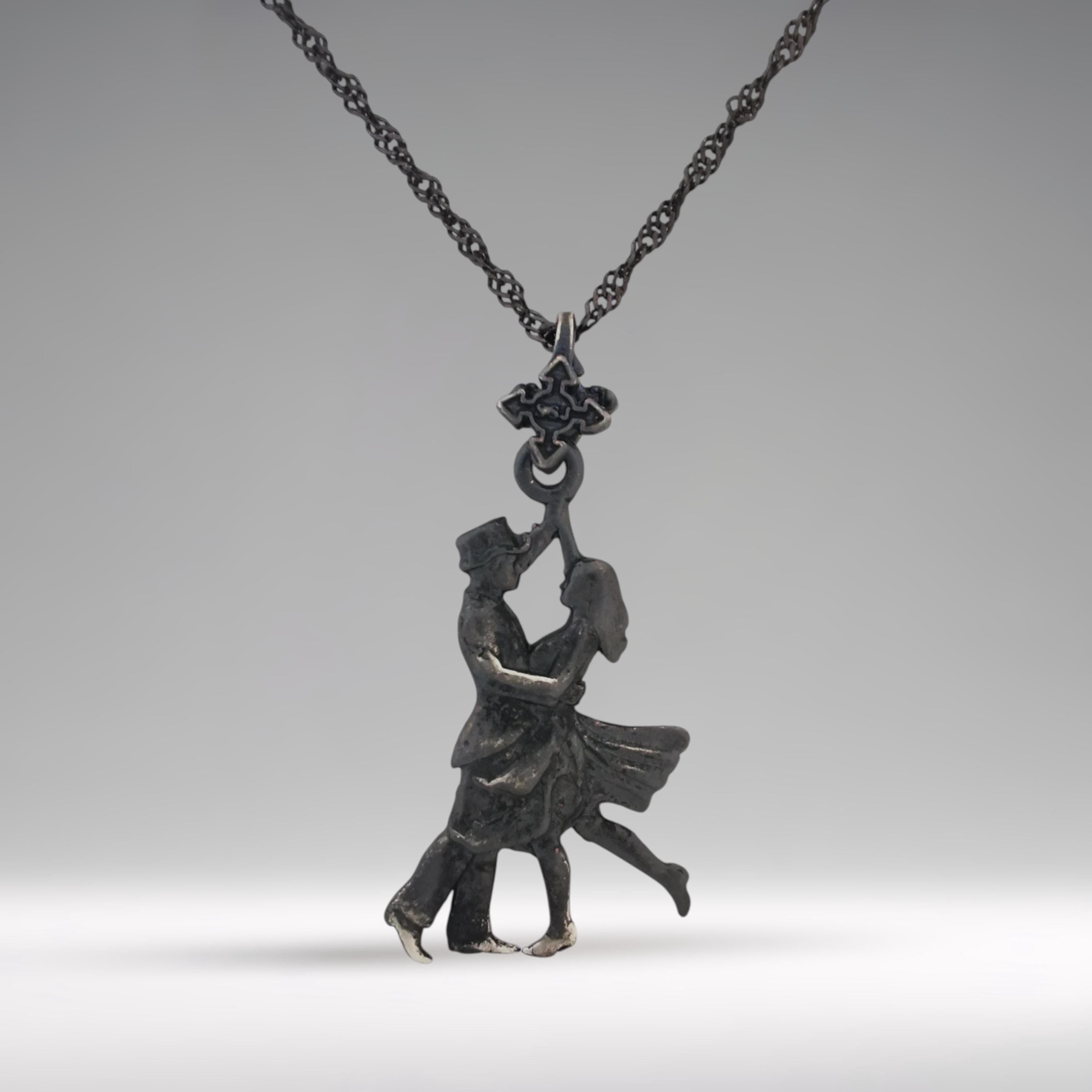 Celebrate the passion of movement with this striking black oxidized 925 sterling silver pendant — a graceful tribute to Latin dance and the timeless allure of tango. With flowing lines and a dynamic silhouette, this piece captures the power of connection, rhythm, and feminine elegance.

🖤 The dark, matte finish gives the pendant a bold, artistic edge — ideal for the woman who dances through life with emotion and intensity.