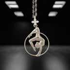 Classic aerial hoop necklace handcrafted from solid 925 sterling silver — a delicate and striking pendant that honors the elegance of aerial performance and the beauty of the human form in motion.

The design features a female aerialist suspended mid-flow, captured in an expressive pose that radiates balance, flexibility, and femininity. A meaningful piece for those drawn to dance, circus art, or the poetic lines of aerial movement. Wearable art with strength and grace.
