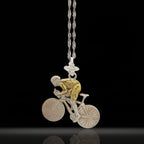 Two-tone cycling pendant handcrafted in solid 925 sterling silver with partial gold plating — a striking piece for men who ride with purpose and pride. The contrast of silver and gold detail highlights movement, determination, and endurance.

Depicting a cyclist in action, this dynamic design honors the passion behind every pedal — whether on the road, in competition, or through personal milestones. A unique gift for men who live for the ride and wear their drive with style.