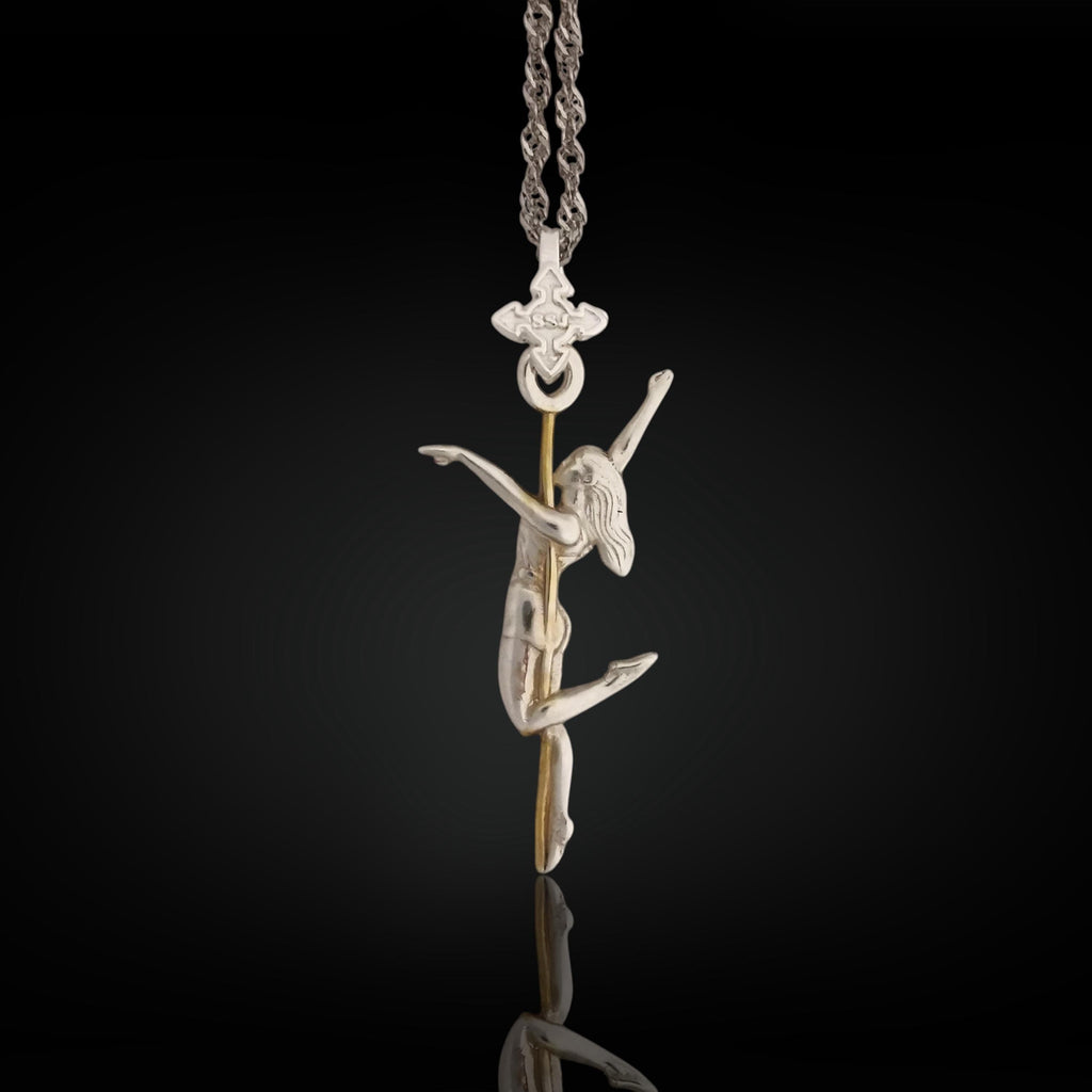 Two-tone pole dance necklace crafted in solid 925 sterling silver with elegant gold plating – a refined and sensual pendant celebrating the beauty of feminine movement.

The design features a graceful woman wrapped around the pole in an expressive pose. The silver-and-gold contrast highlights the curves, energy, and elegance of the performance. A tribute to confidence, desire, and the freedom of self-expression – whether on stage or in life.
