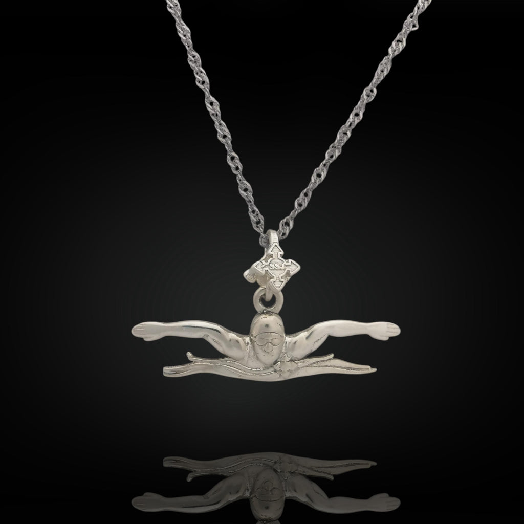 Butterfly swim necklace crafted from solid 925 sterling silver — a sleek pendant capturing the power and focus of the butterfly stroke. Handcrafted for men and teen boys, it&#39;s a meaningful gift for swimmers of all levels.

📏 Details:
• Height: 12 mm (0.47 in)
• Width: 35 mm (1.38 in)
• Weight: 2.26 grams