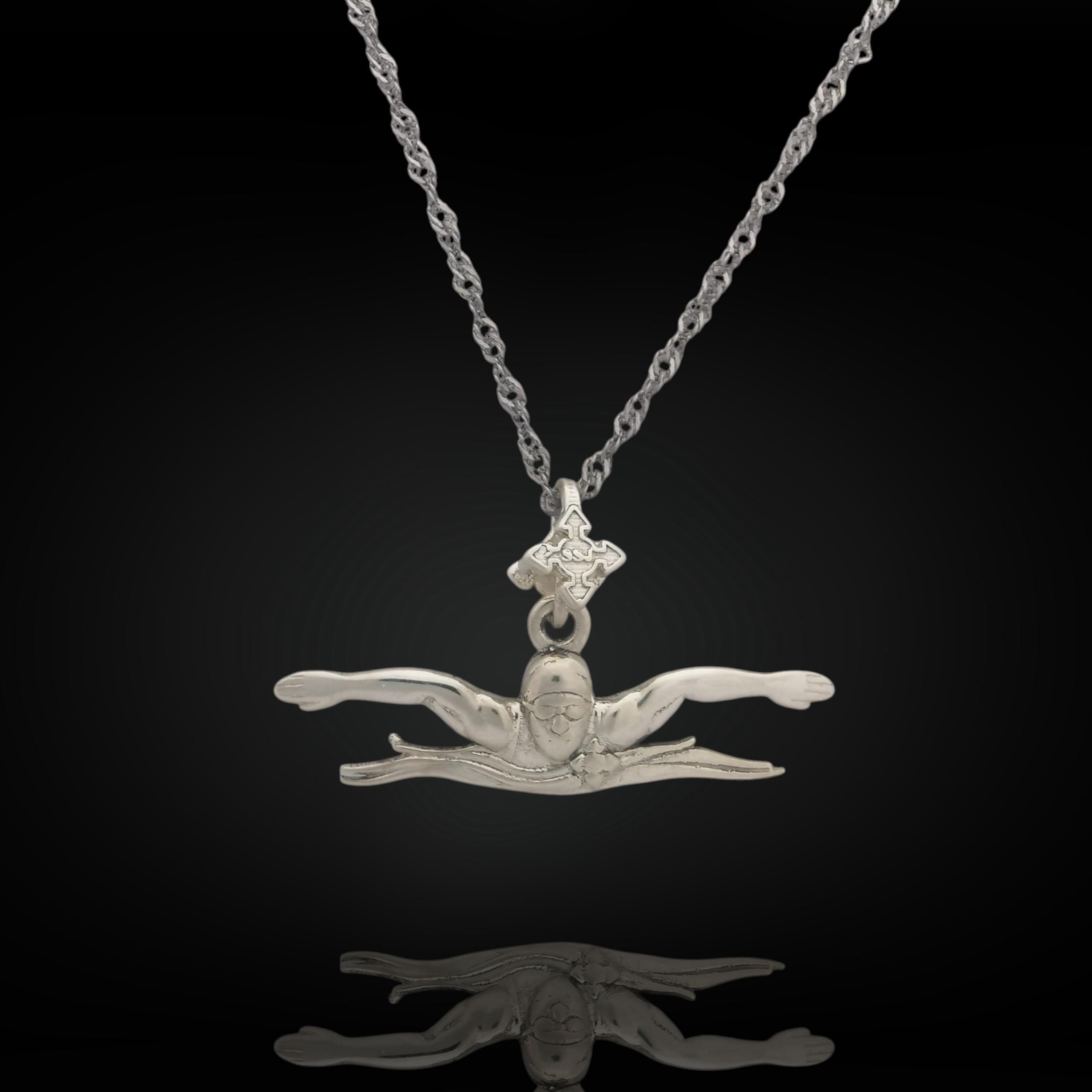 Butterfly swim necklace crafted from solid 925 sterling silver — a sleek pendant capturing the power and focus of the butterfly stroke. Handcrafted for men and teen boys, it&#39;s a meaningful gift for swimmers of all levels.

📏 Details:
• Height: 12 mm (0.47 in)
• Width: 35 mm (1.38 in)
• Weight: 2.26 grams