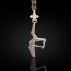 Pole dance pendant handcrafted in solid 925 sterling silver – a radiant and artistic tribute to feminine beauty, strength, and fluid movement.

This sculptural piece captures a pole dancer mid-performance, posed in a dramatic inverted position with expressive detail. The polished silver enhances the flowing curves and emotional intensity of the figure, turning motion into wearable art. A statement of confidence, seduction, and unapologetic expression.