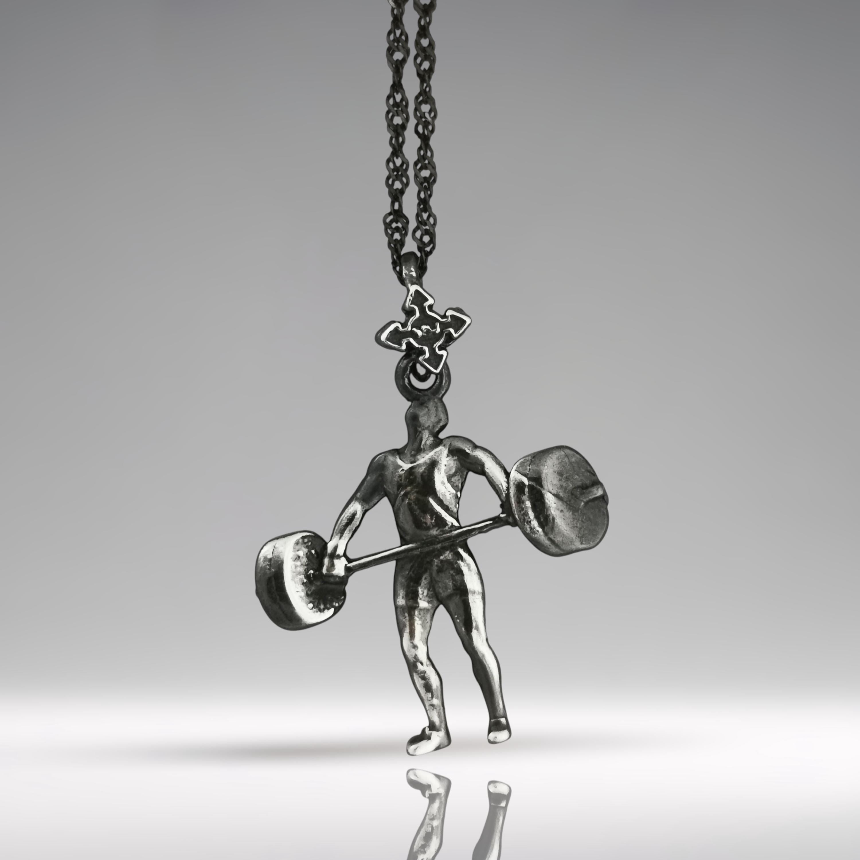 Vintage style weightlifting necklace in solid 925 silver – designed for men who live with strength and purpose. This handcrafted pendant captures the essence of classic gym culture and timeless athleticism.

With its vintage finish and detailed weightlifter form, it&#39;s made for those who appreciate raw effort, discipline, and physical mastery. A meaningful gift for power athletes and fitness mentors.